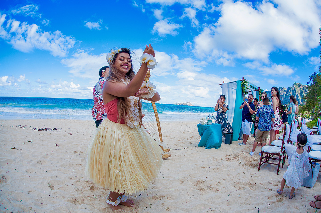 Hula dancer swaying to the ukulele at a Waimanalo beach ceremony